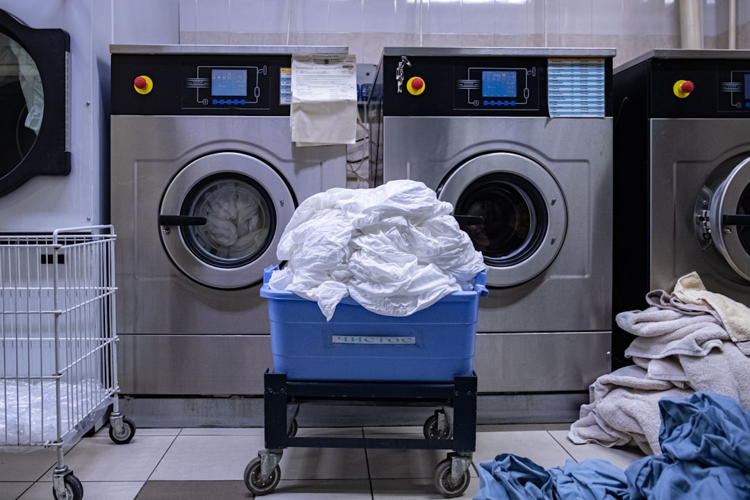 services-04 a-laundry-room-with-a-washing-machine-and-a-laundry-basket-s6jnhci2y-m